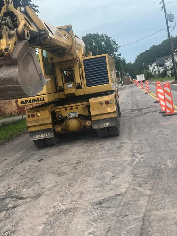 Road construction with equipment and traffic control