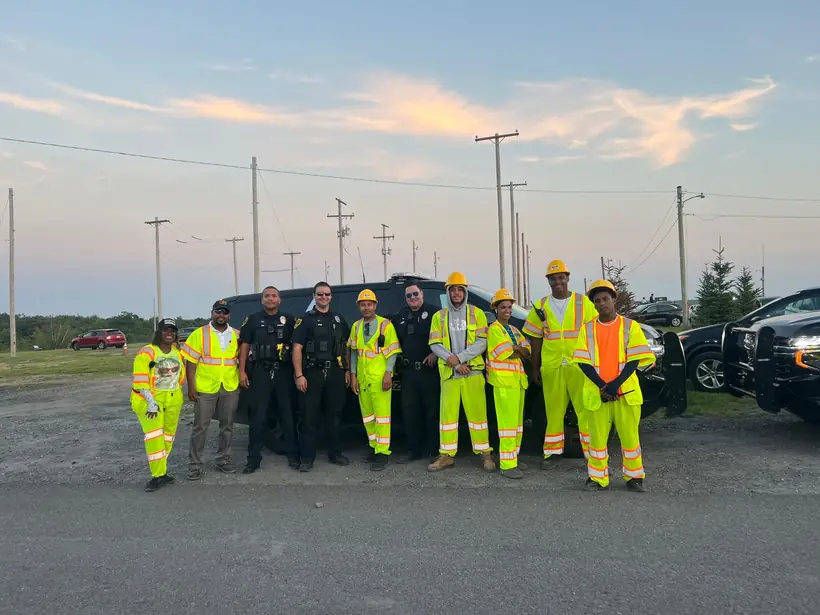 Crew working alongside local police